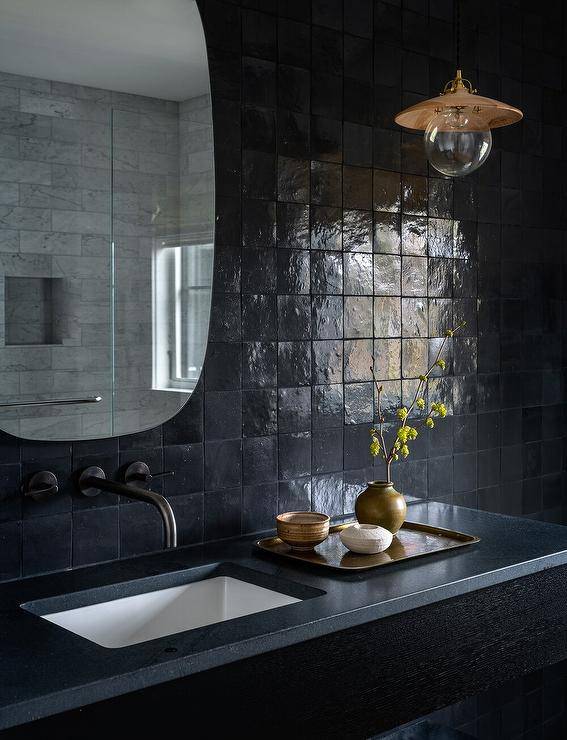 Black Marble and Brass Sink Vanity on Black Wall - Contemporary