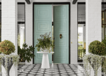 mint green doors on a modern front porch tile black and white with pin stripe awning