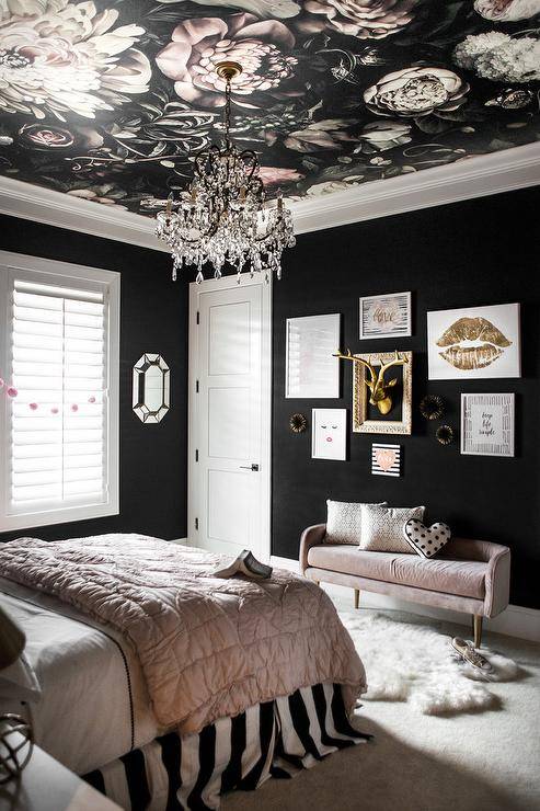 black painted walls in girls bedroom floral ceiling pink velvet couch gallery wall with framed art and gold deer head
