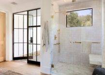 square white tile in walk in shower gold shower kit with marble bench black frame window in shower black frame glass doors