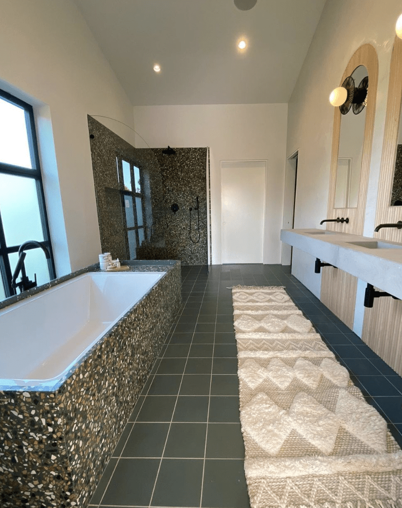 terrazzo framed bathtub green tile flower with boho runner rug