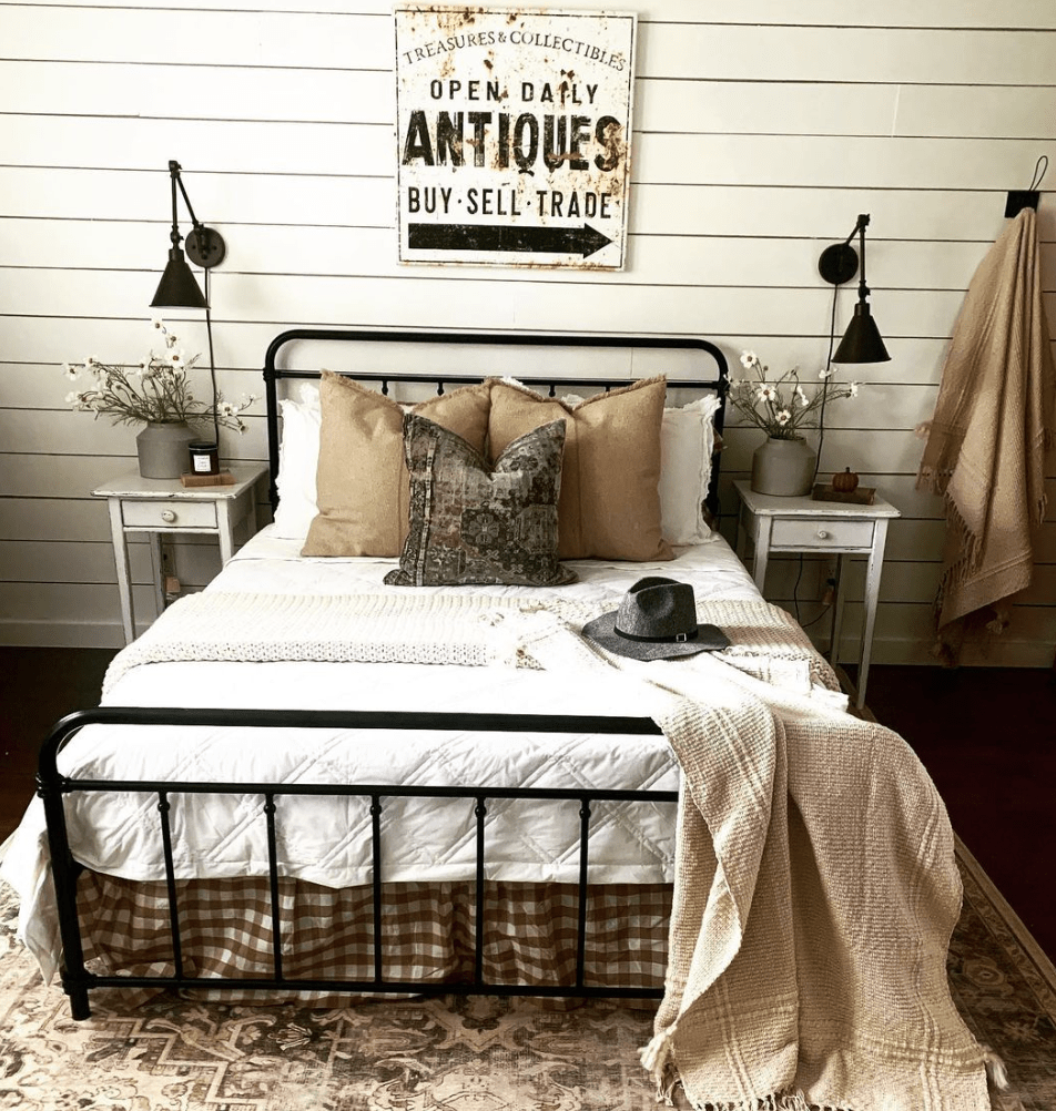 vintage sign in bedroom hanging whilom bed antiques white sheets woebegone iron bed wall sconces