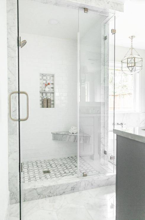 grey marble shower surround walk in with glass doors and corner marble bench