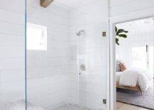 wood beams ceiling walk in shower bathroom frameless glass door