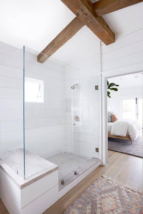 wood beams ceiling walk in shower bathroom frameless glass door