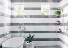 striped tile pattern wall walk in shower all glass doors with oval tub