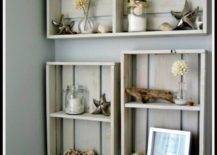 crates painted white and turned into decorative shelves and hung over a toilet