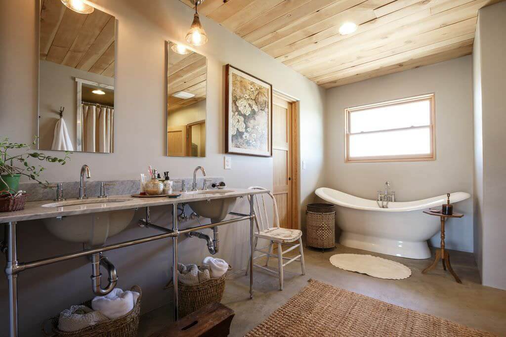 farmhouse style master bathroom with free standing tub rustic mat pedestal chrome his and her sinks with mirrors