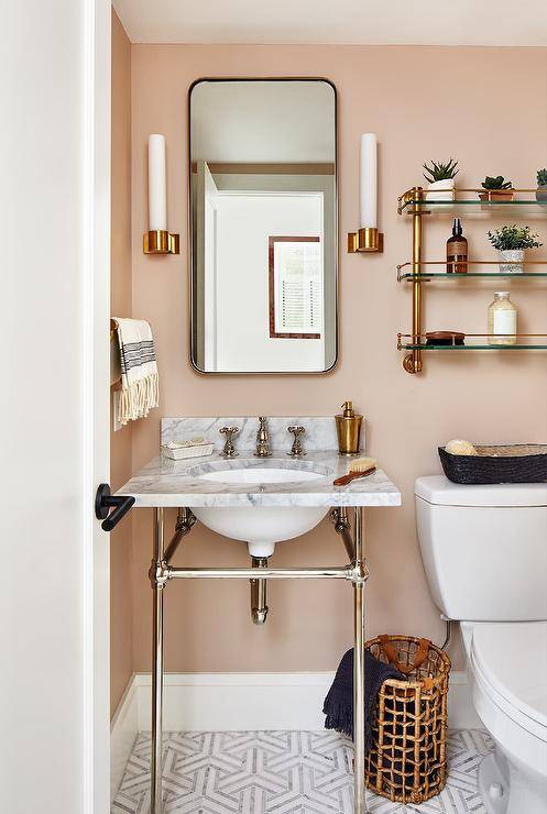 glass shelves over toilet with chrome pipe sink