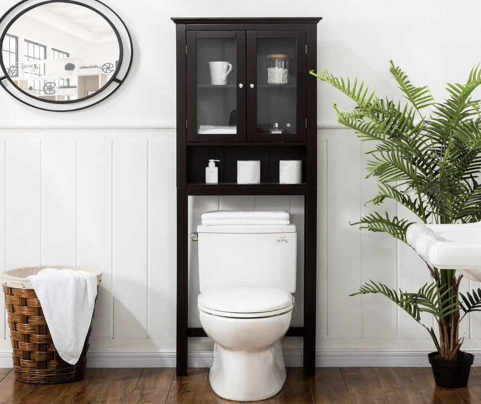 black over the toilet storage hutch white toilet greenery tropical plant basket oval black mirror