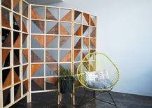 modern geometric room divider with lime green chair pillow and throw