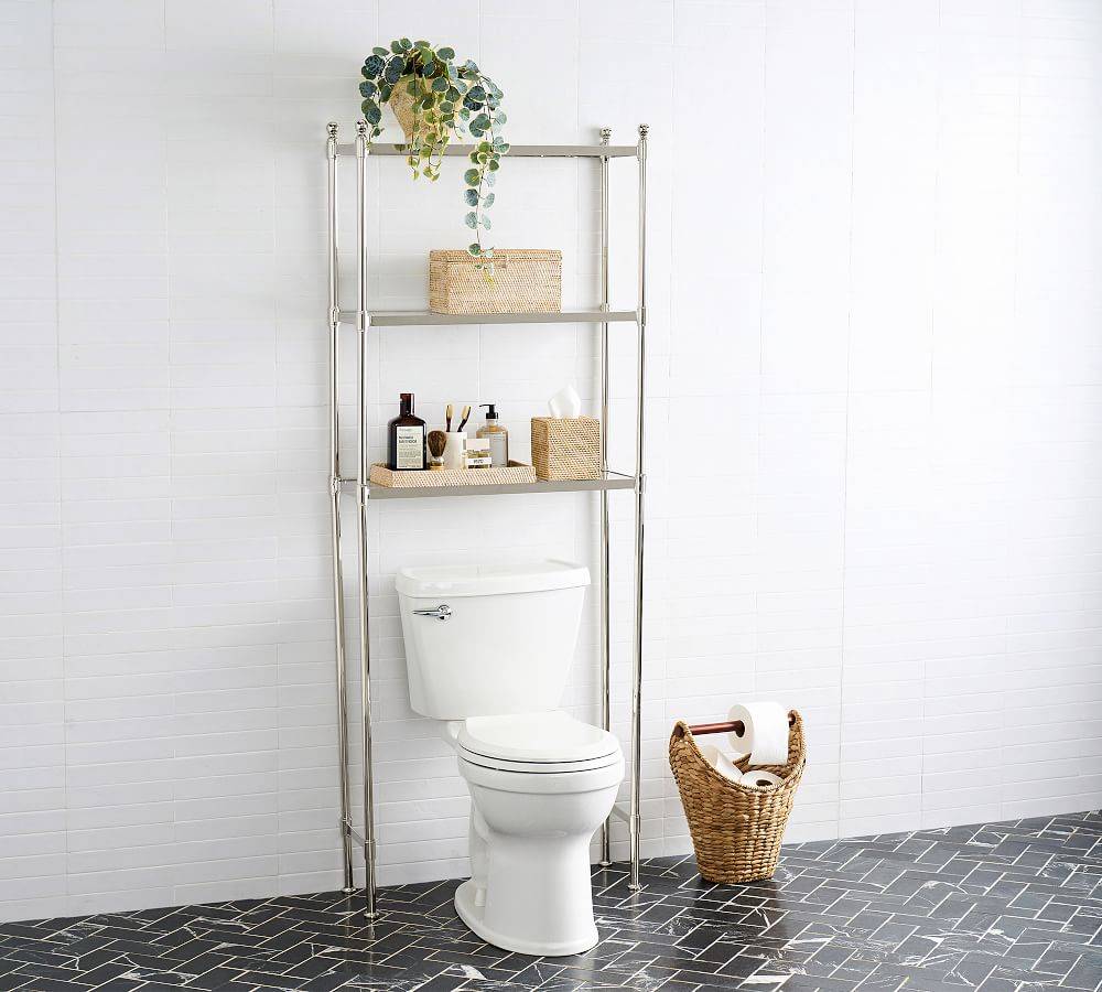 metal pipe over the toilet storage black tile