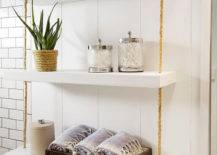 white shelf with hanging rope over the toilet storage ideas