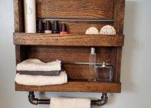 rustic wood towel rack made from a pallet with wrought iron pipe