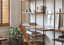 open concept style shelf with fold down desk wood chair in white room