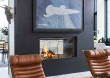 two way fire place with brown leather chairs black modern wall art living room