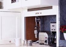 Kitchen features pull-up cabinet concealing hidden small appliances.