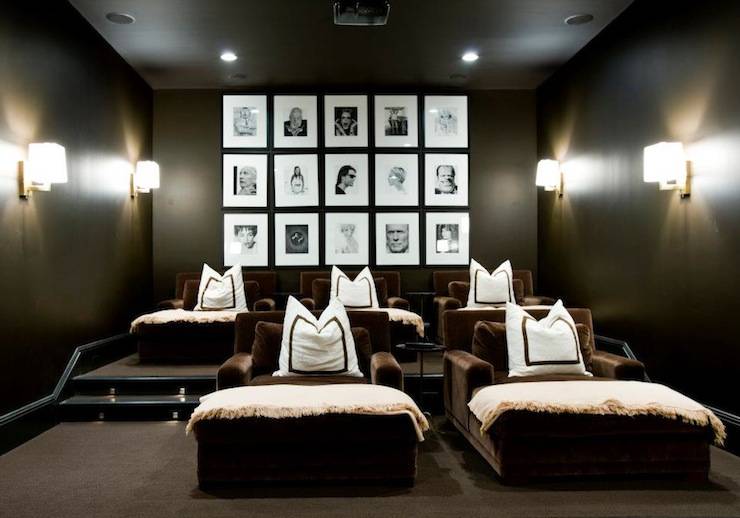 Fantastic movie room design with black walls paint color, chocolate brown velvet lounge chairs, white pillows with brown ribbon trim, ivory cashmere throw blankets, modern polished nickel sconces and black & white photo wall gallery!
