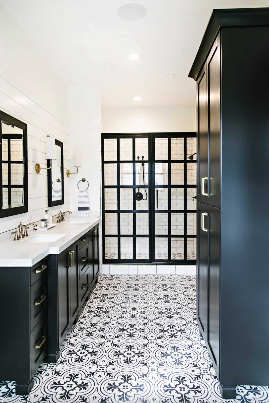 black and white bathroom basement idea pattern floor tile black frame glass shower black vanity