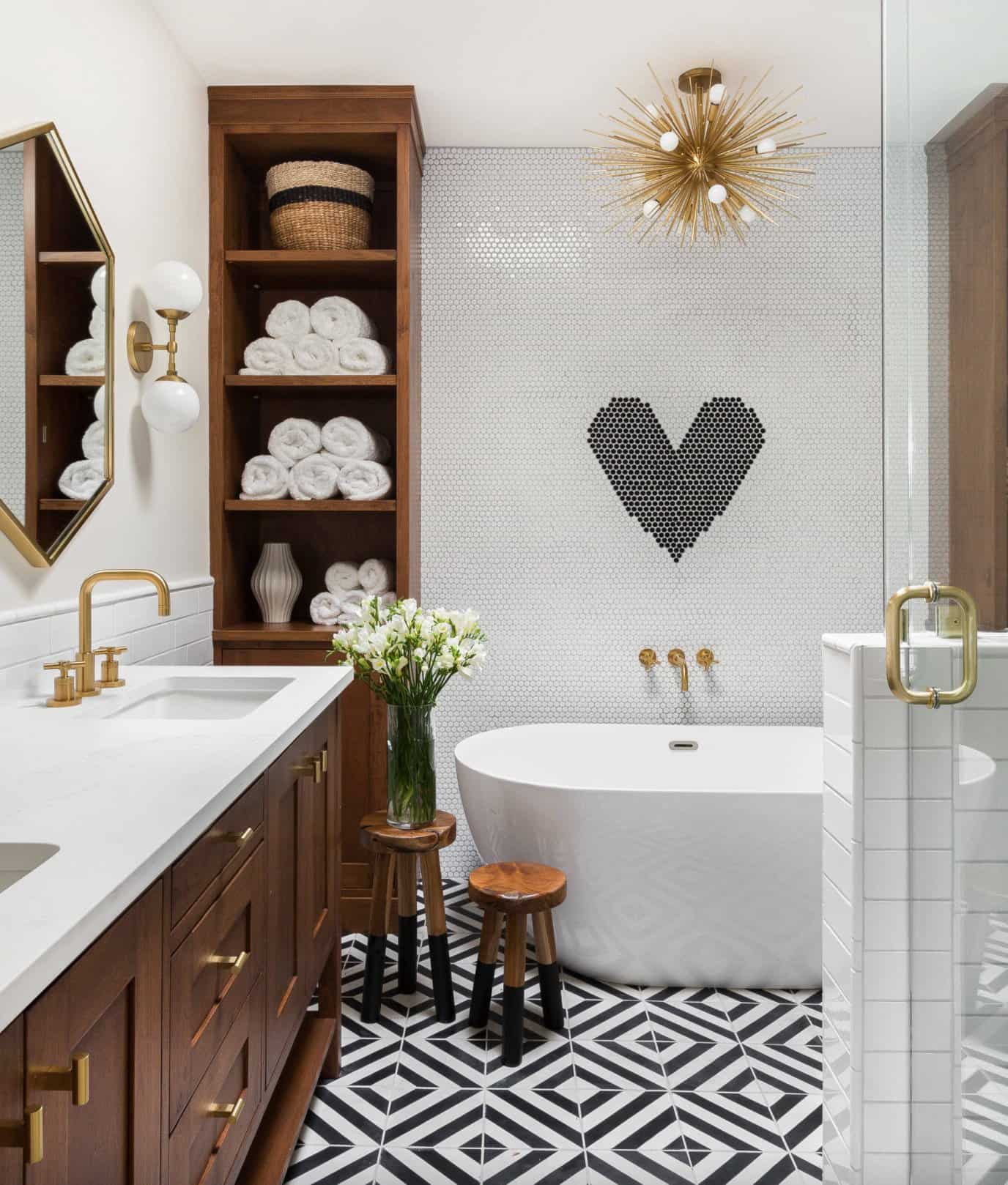 basement bathroom white tile wall with heart free standing tub brown chestnut wood vanity with shelves gold faucts