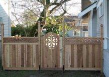 large fence with wooden gate celtic knots design