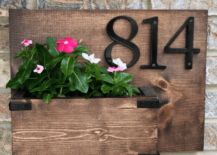 country style wood house address number sign with planter