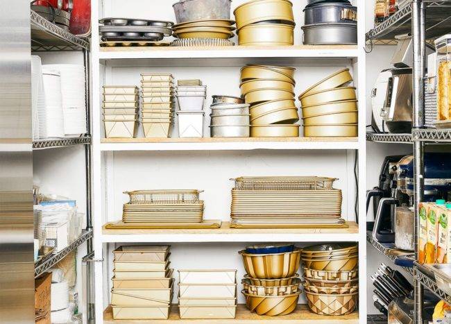 butler pantry kitchen shelving with pots pans and baking ware