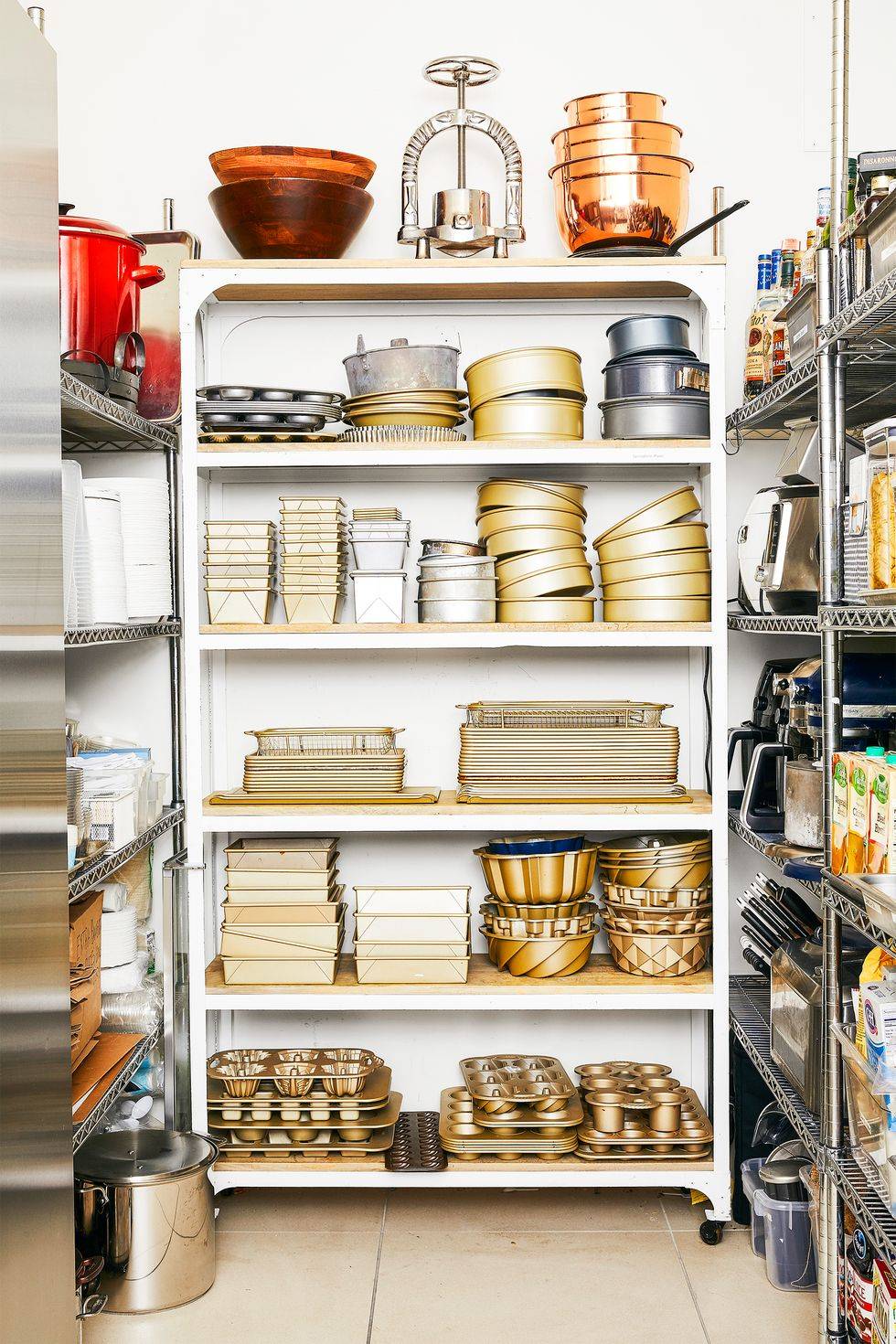 butler pantry kitchen shelving with pots pans and baking ware