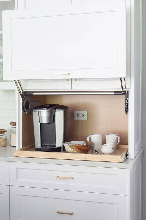 Transitional Kitchen with a coffee station in an appliance garage cabinet brings a unique look with a pull out tray shelf.