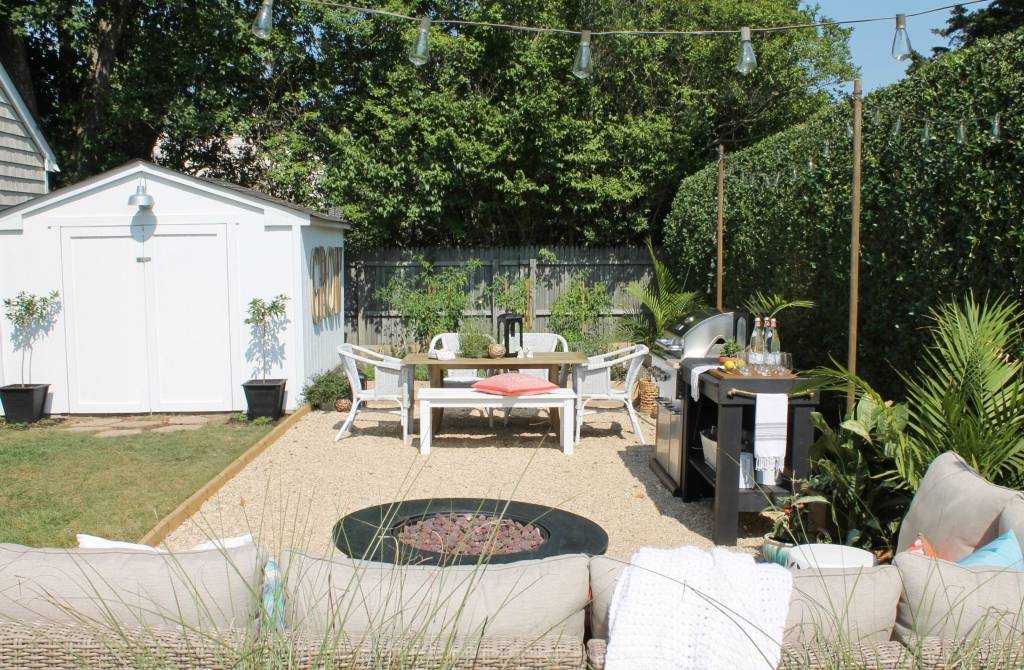 pea gravel outdoor patio with fire pit bbq and dining table