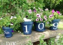 Flower Pot numbers black on bench in garden
