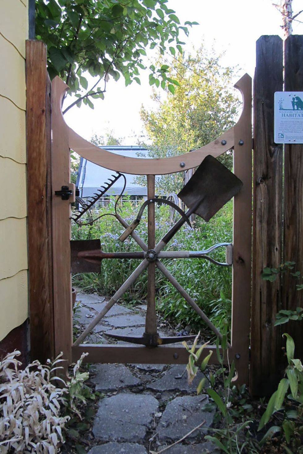 garden gate made out of garden tools