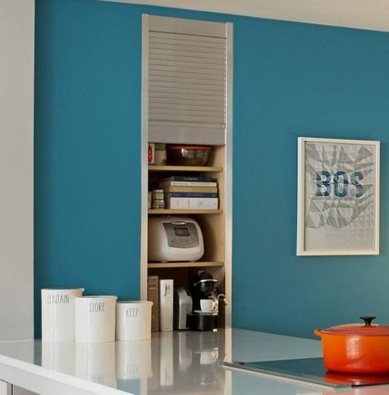 blue wall kitchen with appliance garage built into wall