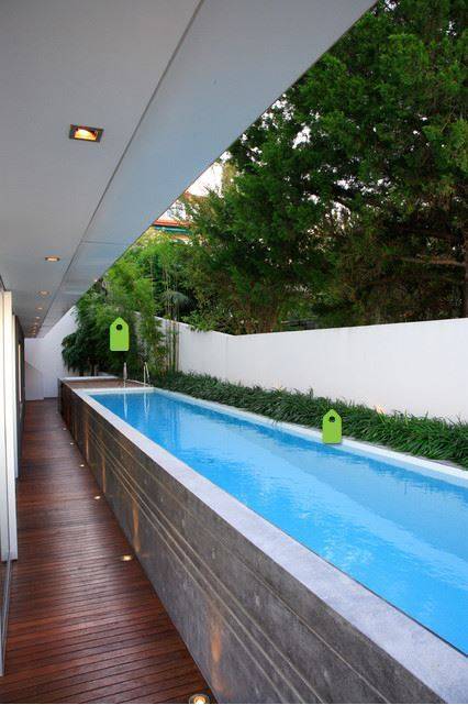 narrow lap pool with wood deck