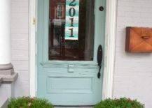 paint stick number sign light blue door with welcome mat