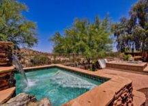 above ground pool framed in with terracotta rustic stone