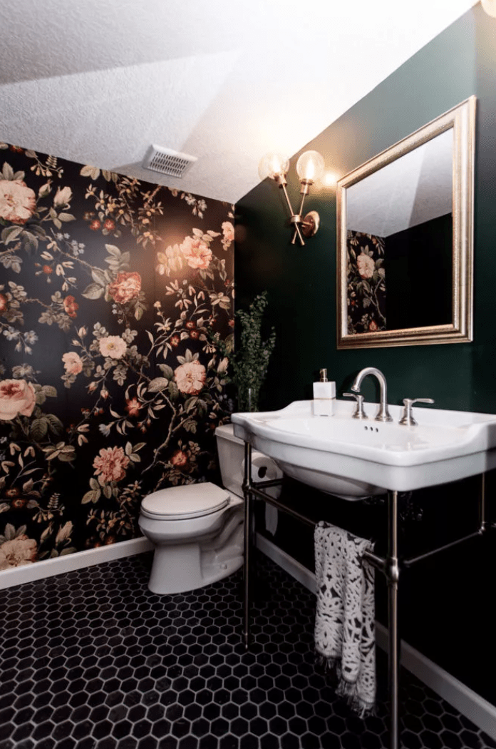 basement bathroom with floral wallpaper green wall pedestal sink and toilet