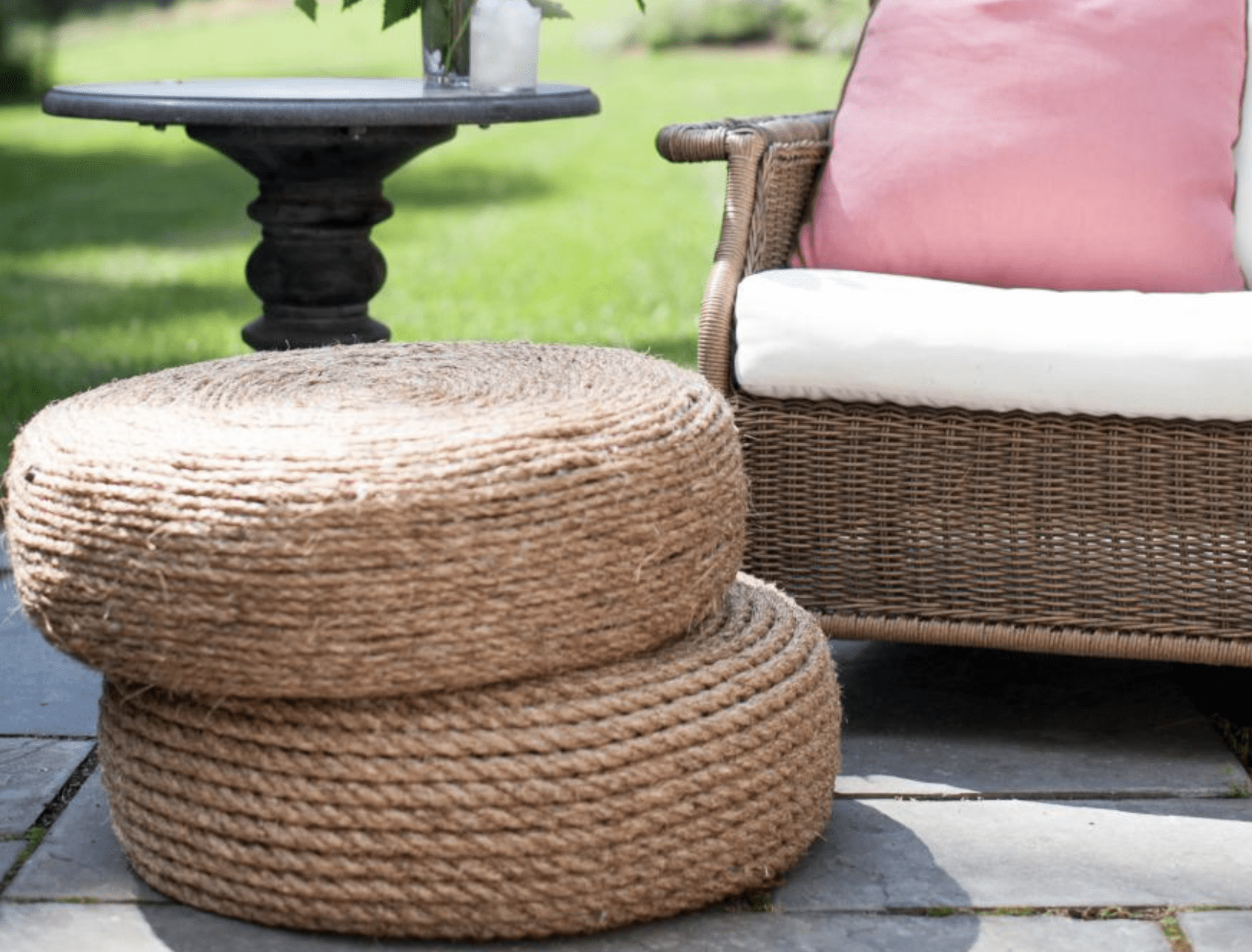 close up of two rope ottomans outside stacked on top of one another
