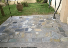 easy flagstone patio with nothing on it in backyard