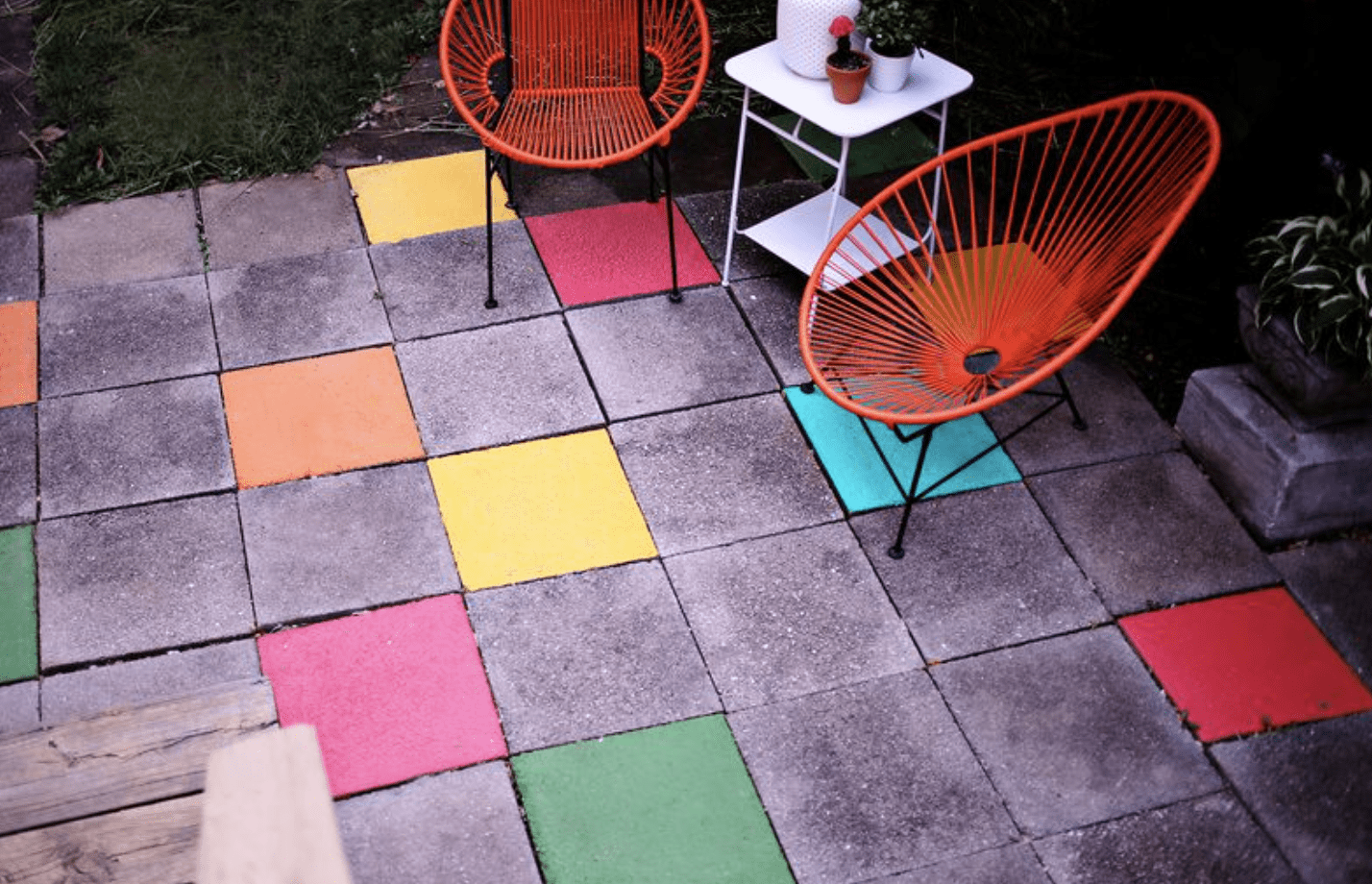 painted patio paver stones with two red chairs