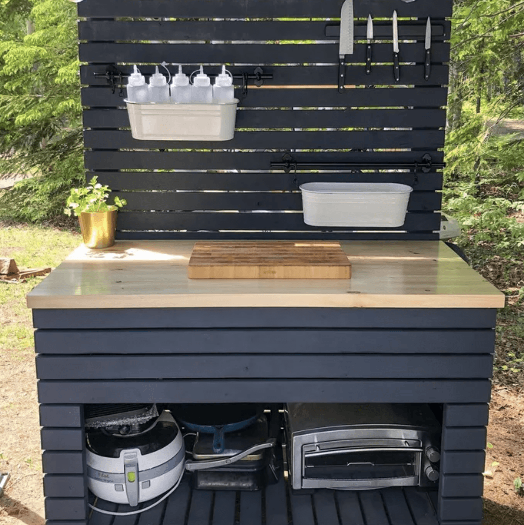 outdoor kitchen island made of pallet wood painted dark blue
