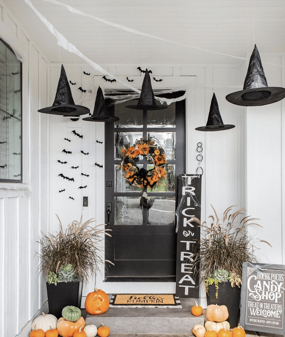 an entryway decorated with witch hats