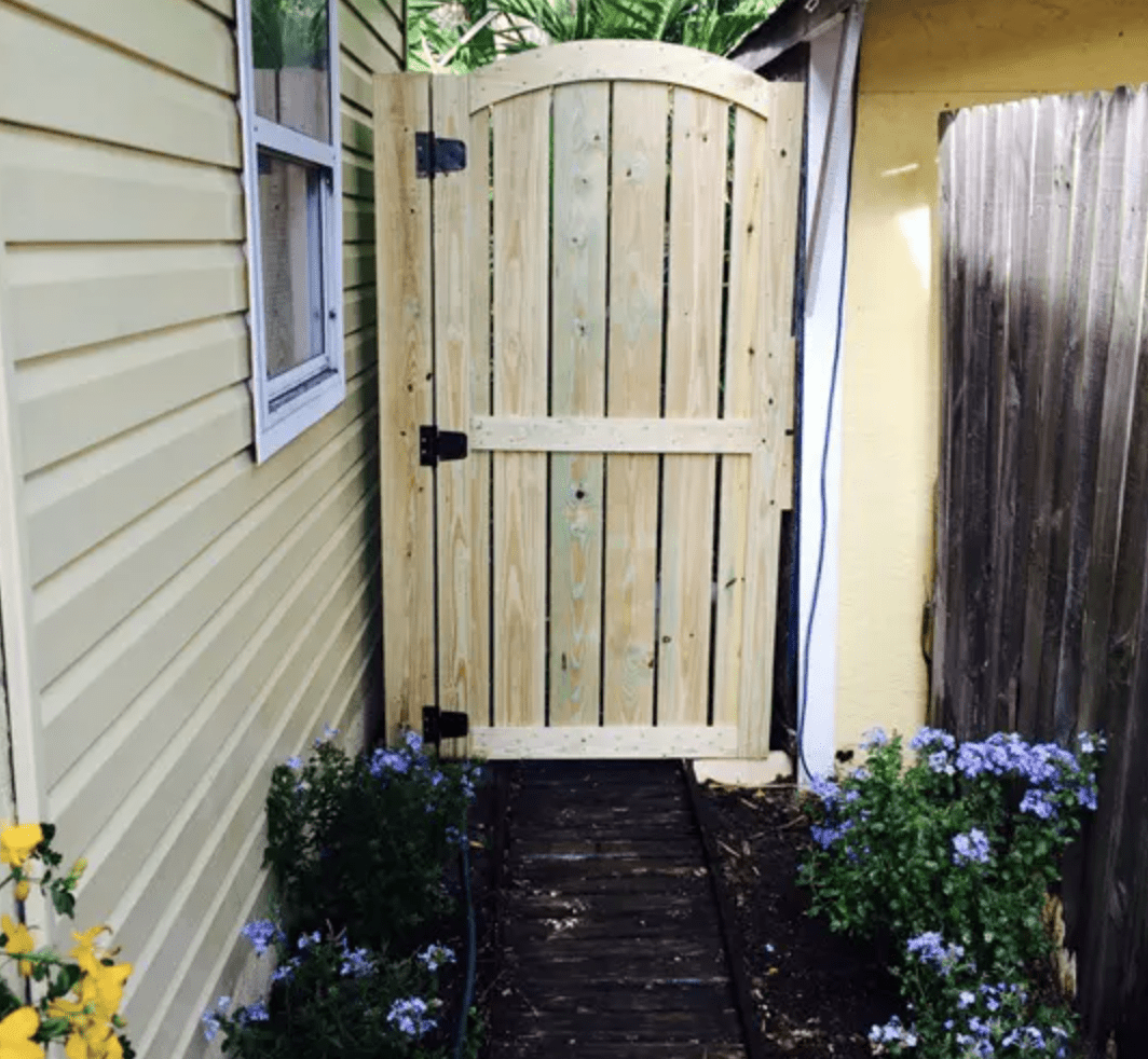 diy unstained fence gate in garden