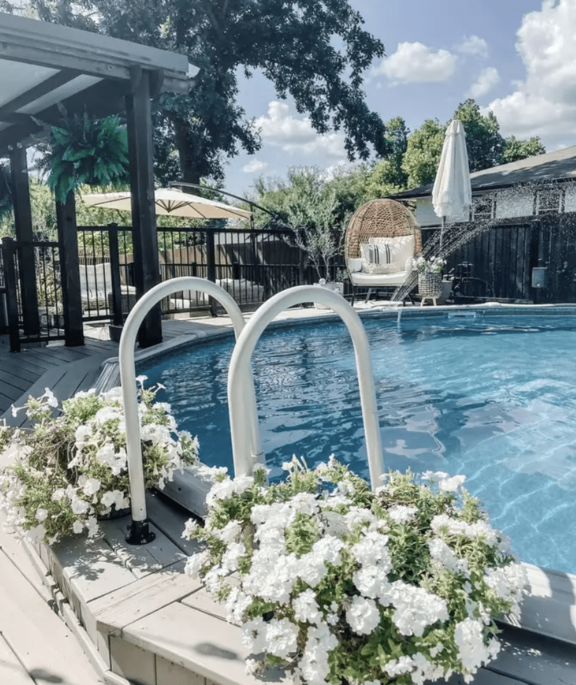 pool fountains above ground pool with planters on either side of the pool ladder