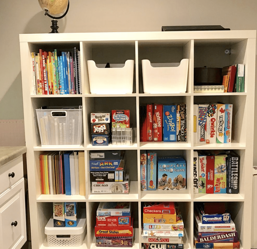 cube storage in basement with board games and books