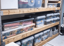 pallet shelves in basement filled with totes and containers