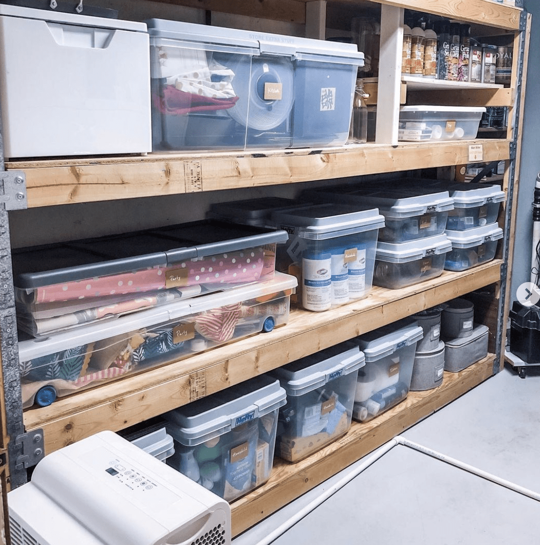 pallet shelves in basement filled with totes and containers