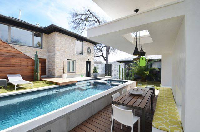 small modern lap pool in tiny backyard with no grass