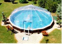 above ground pool with sun dome and brick walkway