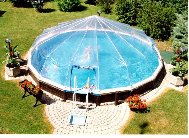 above ground pool with sun dome and brick walkway